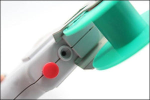 60W Manual Automatic Tin Welding Gun 941-60 Soldering Gun - close-up view showing the grey handle, a red button, a small circular port, and a teal spool holder.