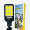 616-4 Motion Sensor Street Lamp - shown with its black plastic body, LED light panel, sensor, power button, and its matching retail box.