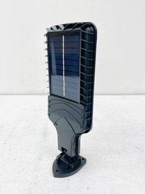 616-4 Motion Sensor Street Lamp - a black plastic solar-powered light fixture with a rectangular solar panel on the front and a mounting base at the bottom.
