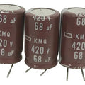 68µF 400V Electrolytic Capacitor - three brown cylindrical electrolytic capacitors with two metal leads each, showing 68µF and 420V printed on the body.