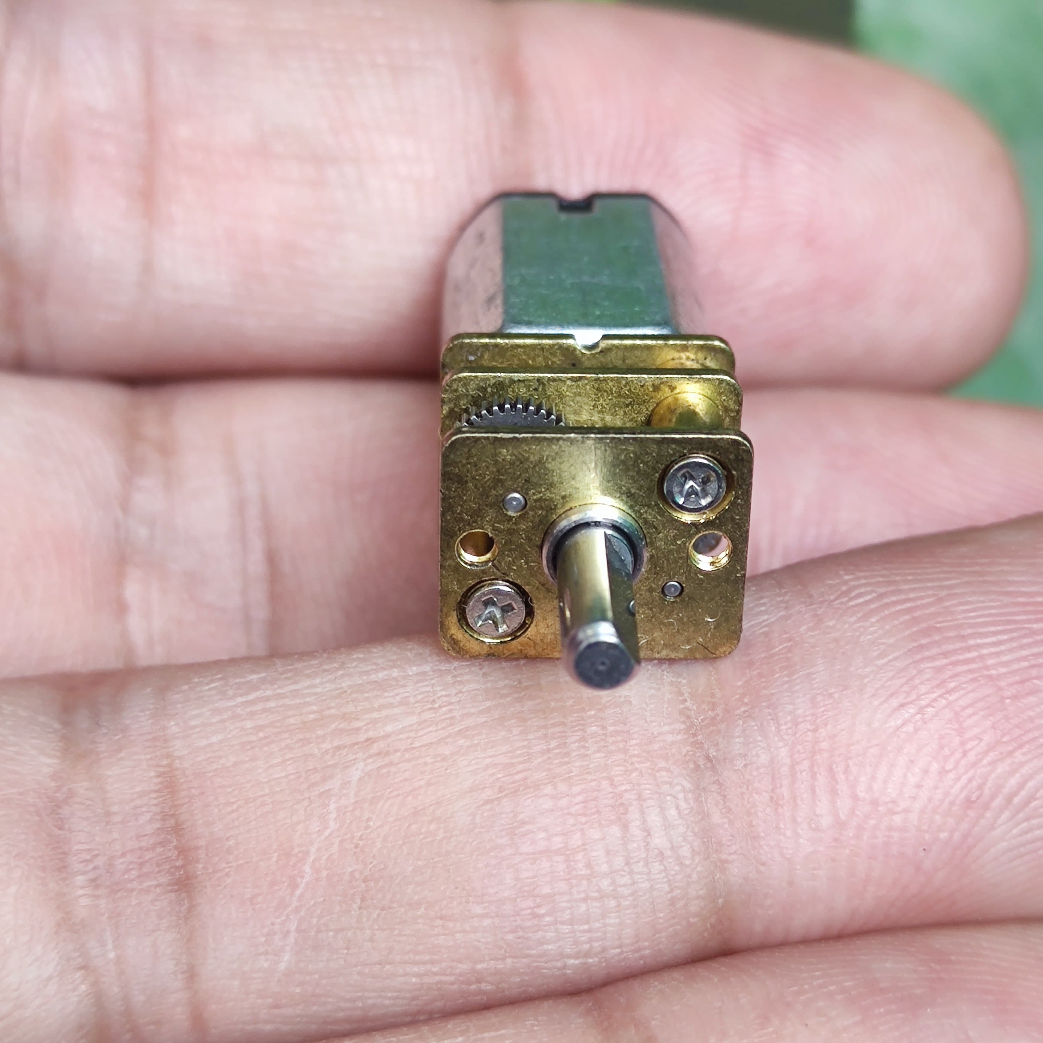 68RPM N20 DC Gear Motor - a close-up view of the front metal gearbox with a central rotating shaft and a small gear visible on the side.