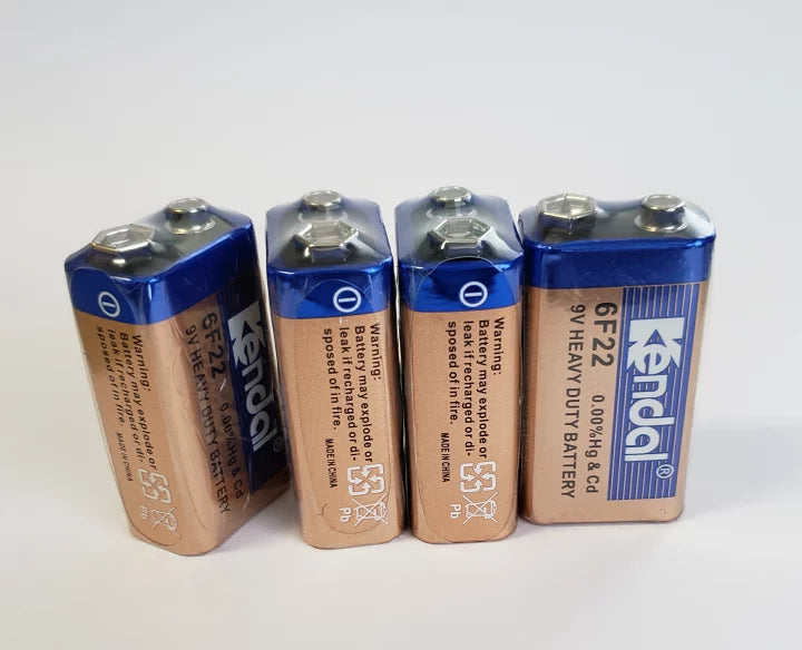 6F22 9V Battery Heavy Duty Battery | Best Price - four rectangular blue and tan Kendal brand 9V batteries standing upright in a row against a white background.