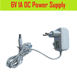 6V 1A DC Power Supply Adapter Charger - a white wall-plug power adapter with a two-pin European-style plug and a white cable with a DC barrel jack.