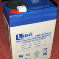 6V 4.5Ah Rechargeable Battery - a white rectangular lead-acid battery with a blue top, two metal terminals, and printed specifications on the front.