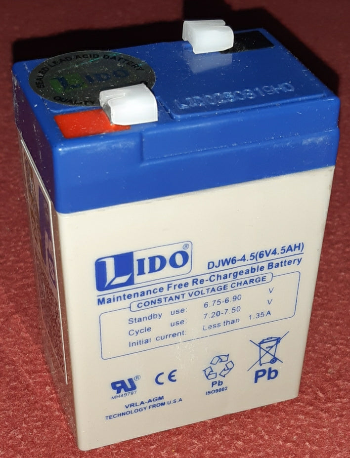 6V 4.5Ah Rechargeable Battery - a white rectangular lead-acid battery with a blue top, two metal terminals, and printed specifications on the front.