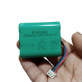 6V Battery 2000mAh Ni-MH Battery Pack Size AA Rechargeable - a green cylindrical battery pack with a three-pin white connector held in a hand.