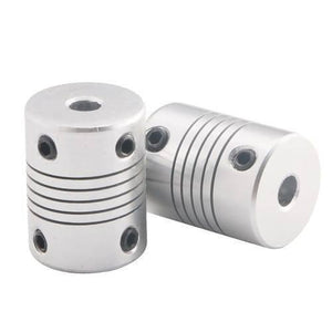 6x6mm Flexible Coupling Shaft - two silver-coloured cylindrical metal couplings with grooved bodies and black set screws on a white background.