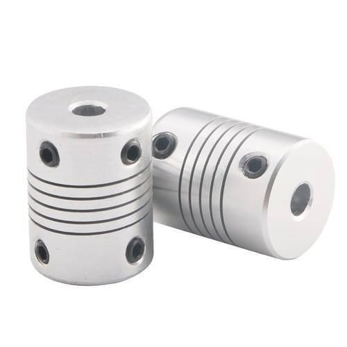 6x6mm Flexible Coupling Shaft - two silver-coloured cylindrical metal couplings with grooved bodies and black set screws on a white background.