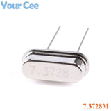 7.3728MHz Crystal Oscillator For Local Solar Inverter - a silver-coloured, oval-shaped metal component with two wire leads and the text 7.3728 etched on its surface.