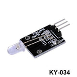 7 Color Flashing LED Module Ky 034 Hw-481 - shown as a black circuit board with a clear LED and three metal connector pins.