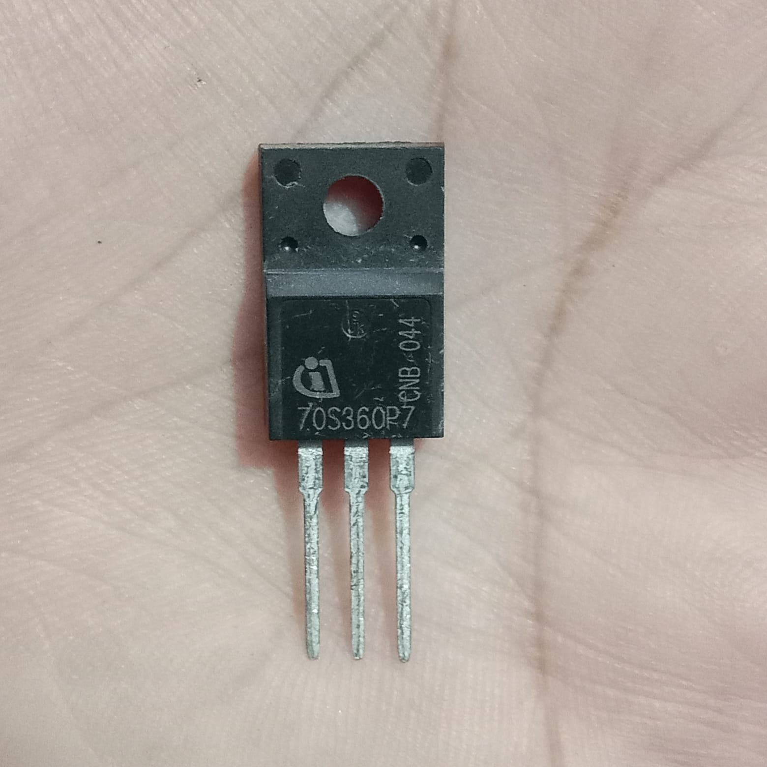 70S360P7 Infineon N-Channel Power MOSFET - a black, three-pin electronic component with a metal mounting tab, shown in a close-up view held in a hand.