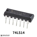 7414 74LS14 Schmitt Trigger Hex Inverter IC - a black 14-pin dual in-line package integrated circuit with silver pins, viewed from an elevated angle.