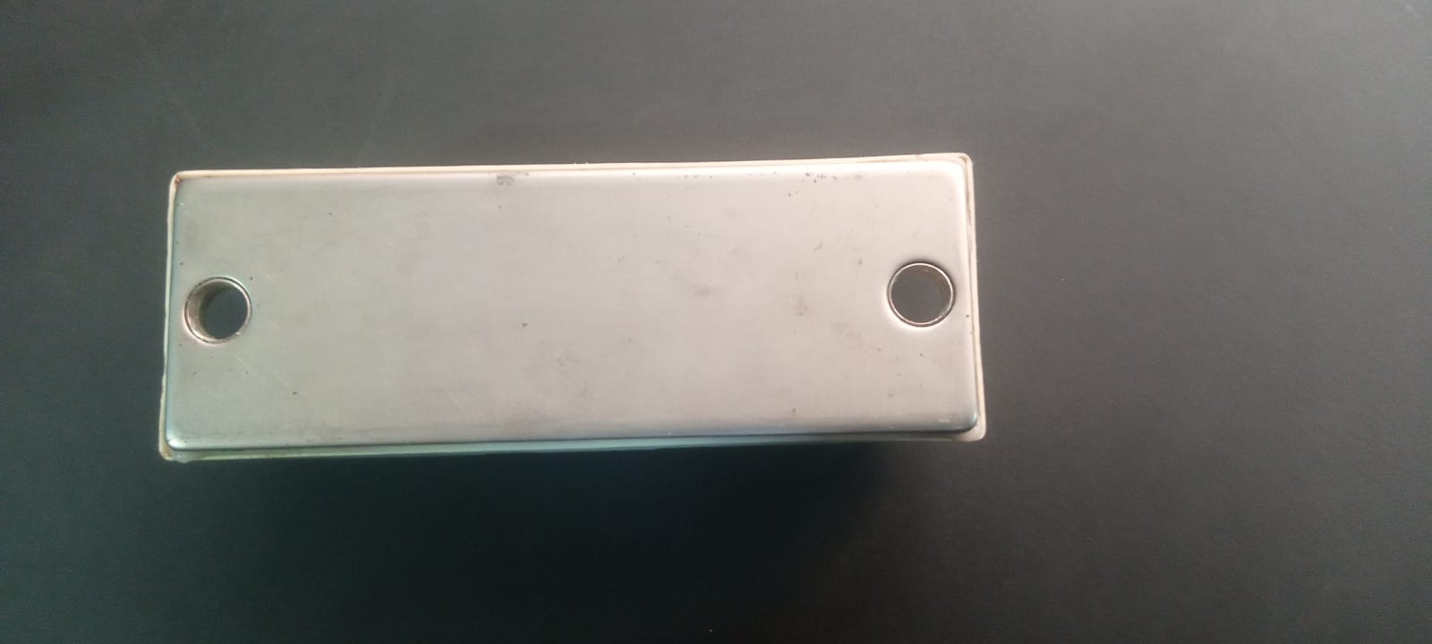 75A 1200V IGBT Module - shown as a rectangular silver-toned metal component featuring two mounting holes on a dark surface.