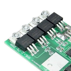 7s 24V 20A 18650 Lithium Lion Battery Charger Module Protection Board BMS PCB With Wire - a close-up view of the green PCB featuring four black IRF83607 MOSFETs and metal screw terminals.