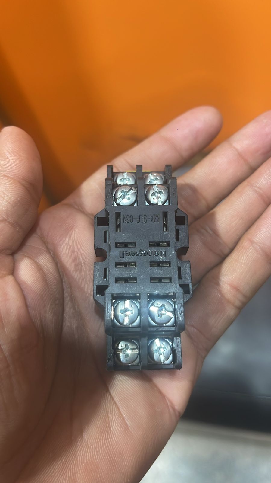 8 Pin Relay Socket Base Thick Copper 10A Mini Relay Socket Base - a black plastic 8-pin relay socket base with eight screw terminals and Honeywell branding held in a person's hand.