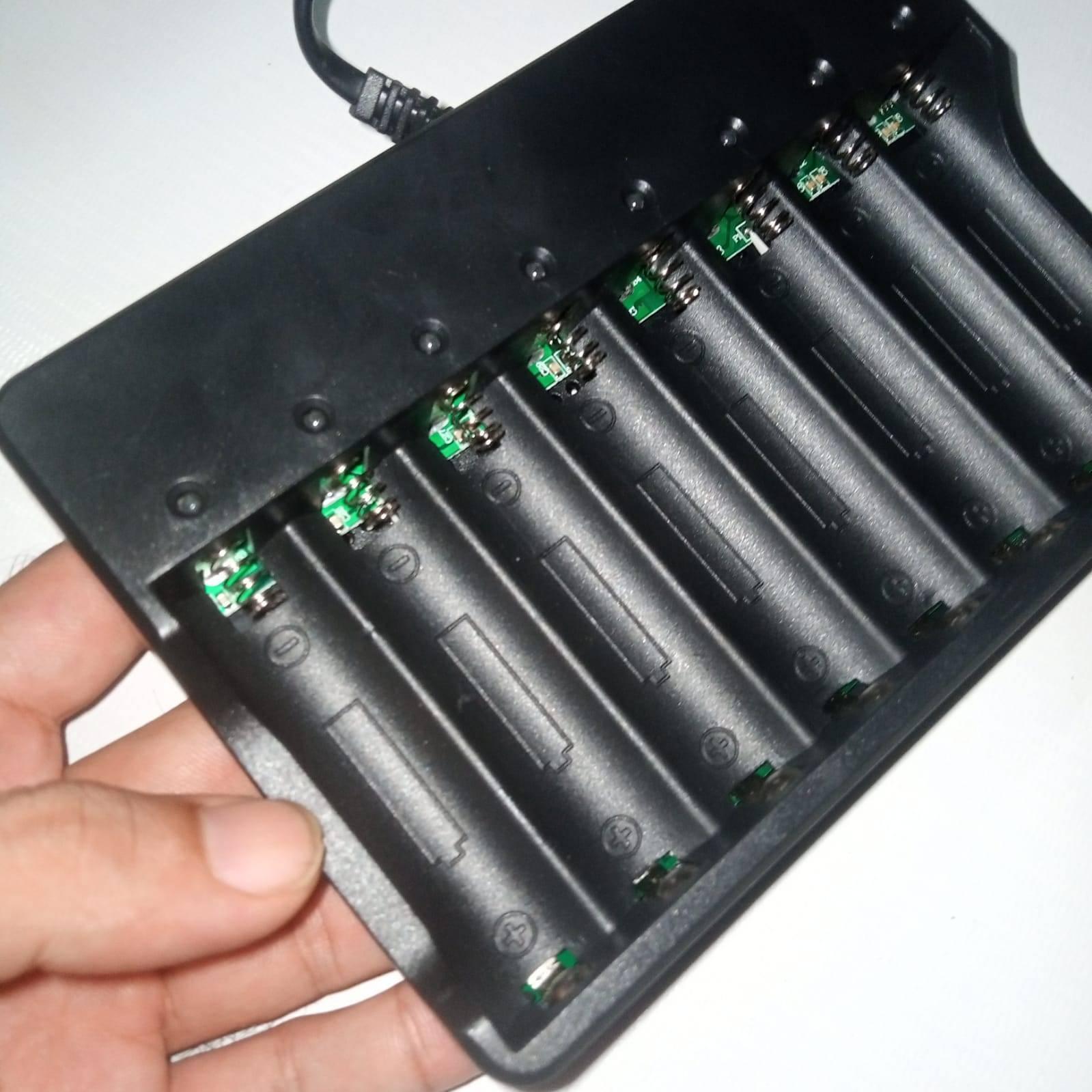 8 Slot 18650 Charger Li Ion Battery Charger 220V Input - shown as a black plastic charging unit with eight battery slots and a power cable.