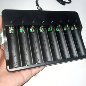 8 Slot 18650 Charger Li Ion Battery Charger 220V Input - a black plastic charging station with eight battery slots, metal spring contacts, and a power cord.