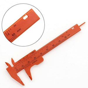 80mm Plastic Vernier Caliper | Dual Scale Mini Measuring Tool - an orange sliding measuring tool with a main scale and a zoomed-in circular inset showing the 80mm and inch markings.