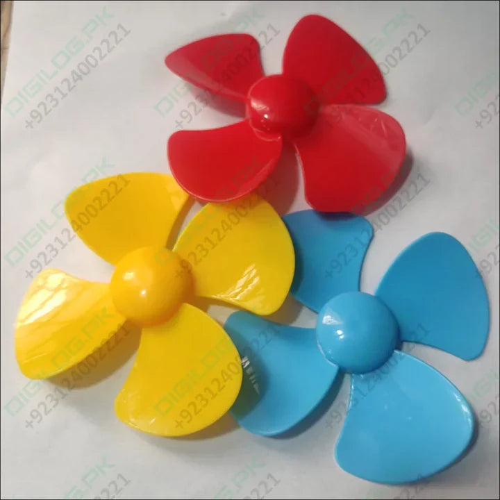 98mm DIY Blade Propeller Plastic Fan For Mini DC Toy Motor - three four-blade plastic fans in red, yellow, and blue arranged on a white surface.