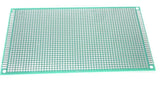9CMX15CM Double Sided Fiberglass PCB Veroboard/stripboard - a rectangular green circuit board with a grid of copper-plated holes and edge connectors.
