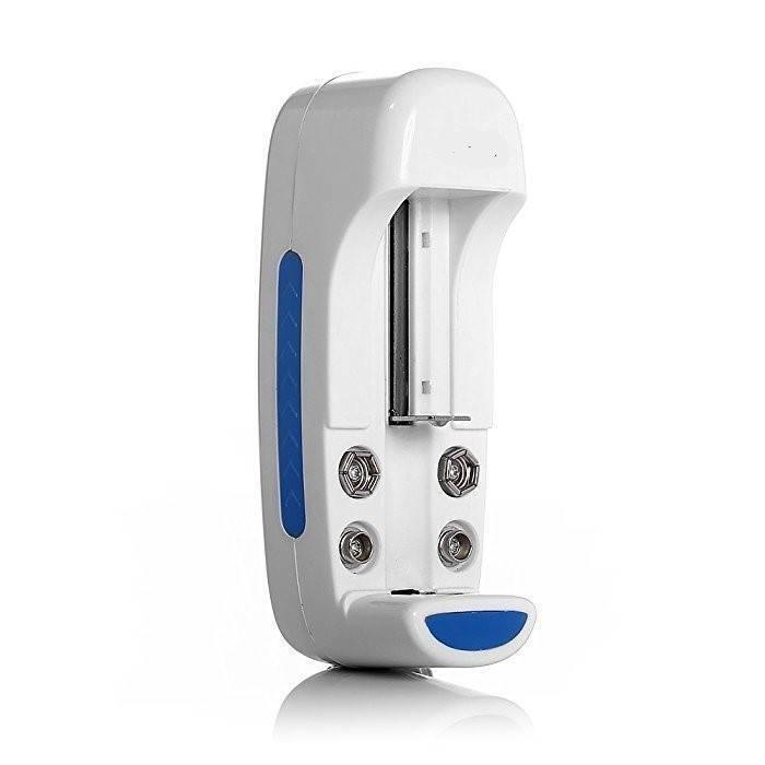 9V Universal Battery Charger - a white plastic device with a vertical battery slot, four metal contact pins, and blue accents on the side and base.