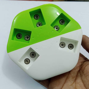 9V Universal Battery Charger - a white and green plastic device with five pairs of metal contact points for charging 9V batteries.
