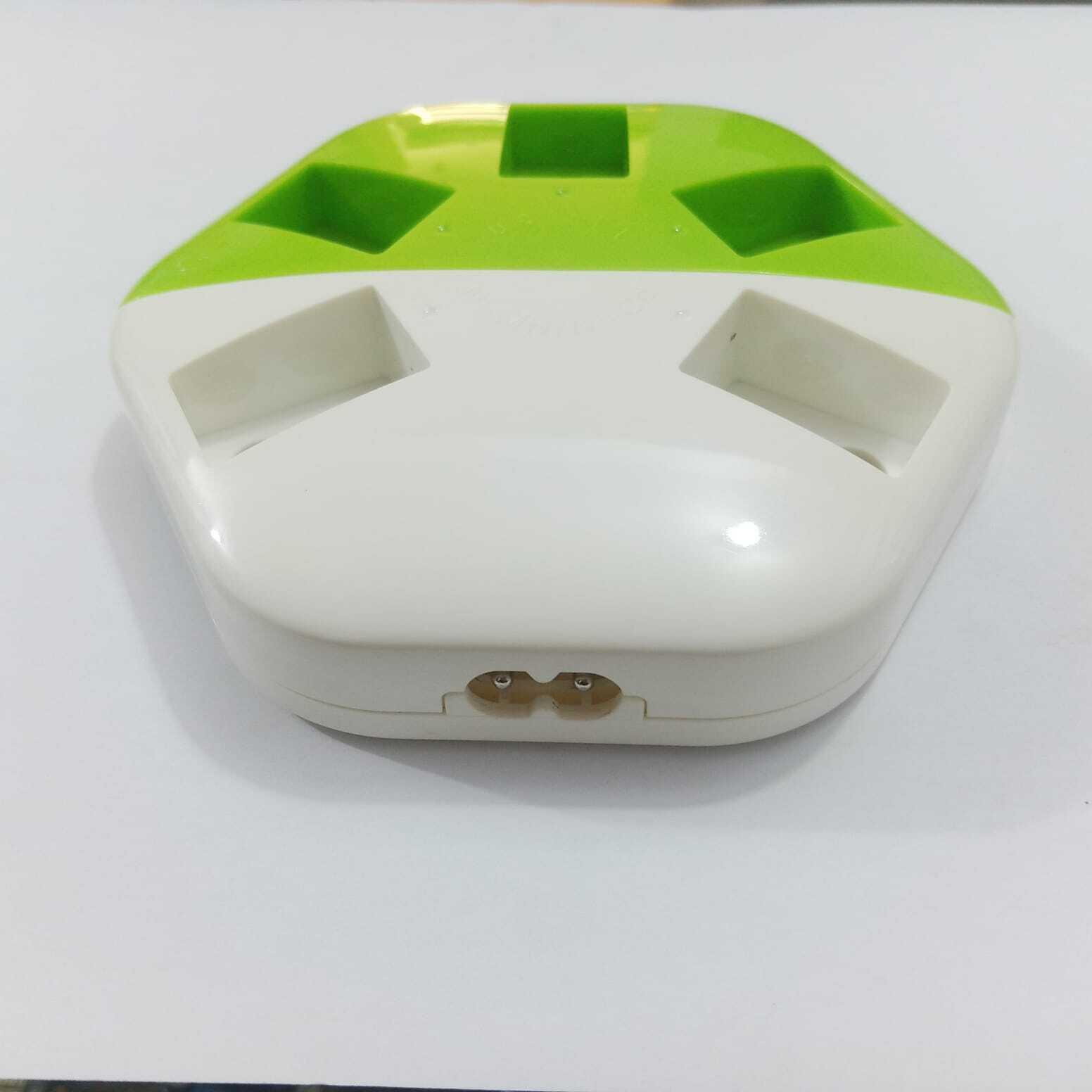 9V Universal Battery Charger - a white and green hexagonal device with a two-pin power input port on the front edge.