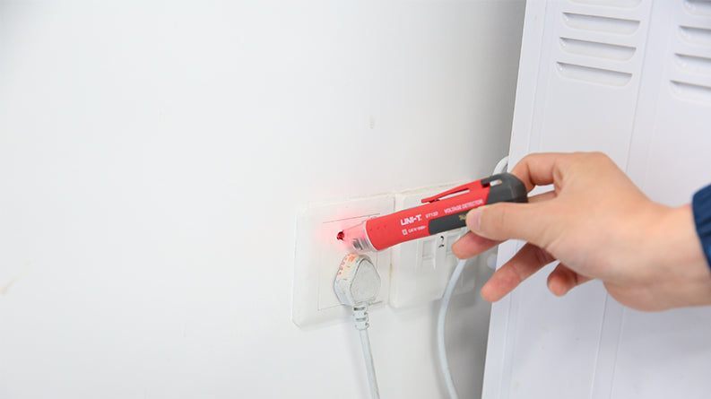 UNI-T UT12D voltage detector with flashlight in use