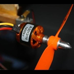 A2212 1400kV Brushless DC BLDC Motor For DIY Rc Aircraft Multicopter - a close-up showing the orange cylindrical motor body with a black label and an attached orange propeller.