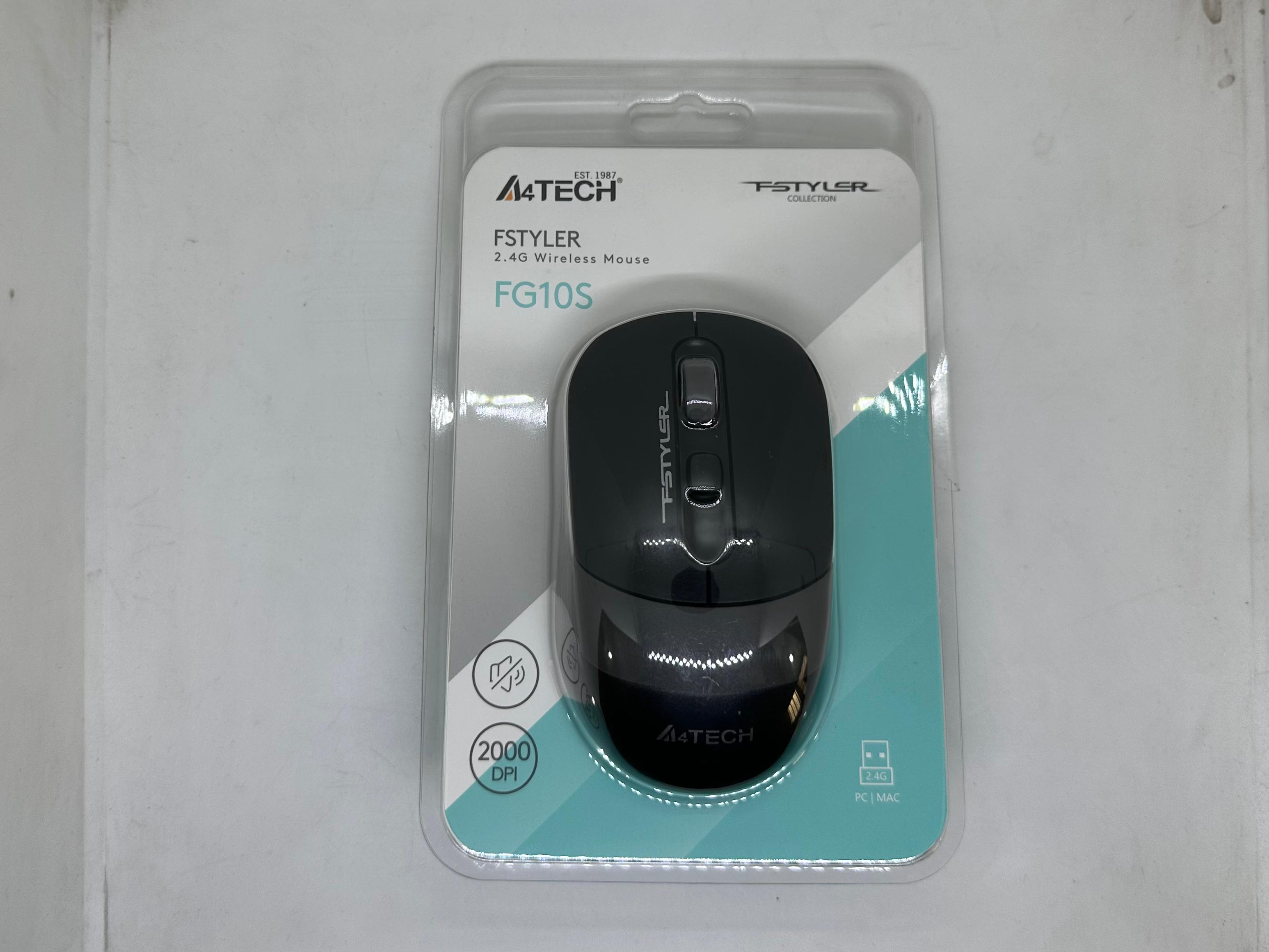 A4tech Fstyler FG10S 2.4g Wireless Mouse – 2000 Dpi Silent Click - in its original clear plastic retail packaging, showing the black mouse with a scroll wheel and two buttons.