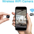 A9 Mini Wi-Fi Camera 1080P Full HD Wireless Ip Camera - a small black circular lens held by fingers next to a smartphone displaying a live view of a living room interior.