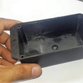 ABS PCB Enclosures Box Electronics Enclosures Box Electronics Project Box - a black rectangular plastic electronics project box held in a hand showing the open interior and mounting holes.