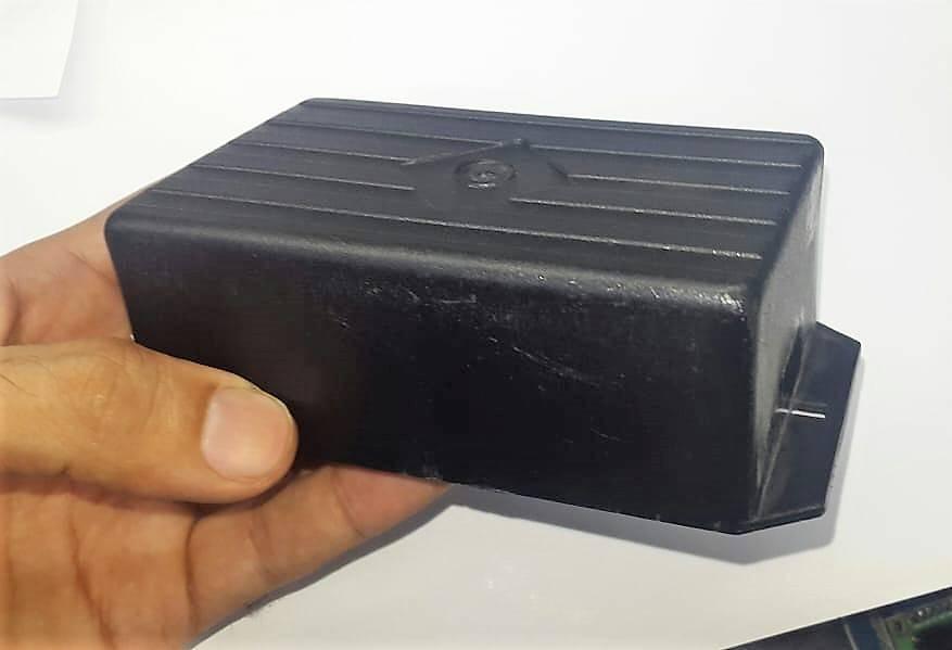 ABS PCB Enclosures Box Electronics Enclosures Box Electronics Project Box - a black rectangular plastic electronics project box held in a hand, featuring a ribbed top surface.