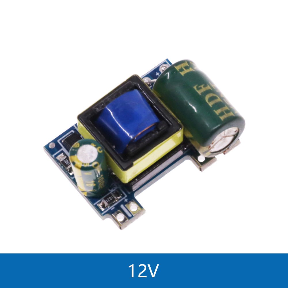 AC-DC 3.5W Isolated Switching Power Supply Module - 5V 700mA / 9V 500mA / 12V 450mA - a small blue and yellow circuit board with a large green capacitor and a blue transformer.