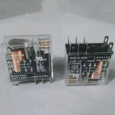 AC Relay Coil AC220V AHN211YO - shown as two identical transparent plastic electromagnetic relays with visible copper coils and metal pins on a white background.