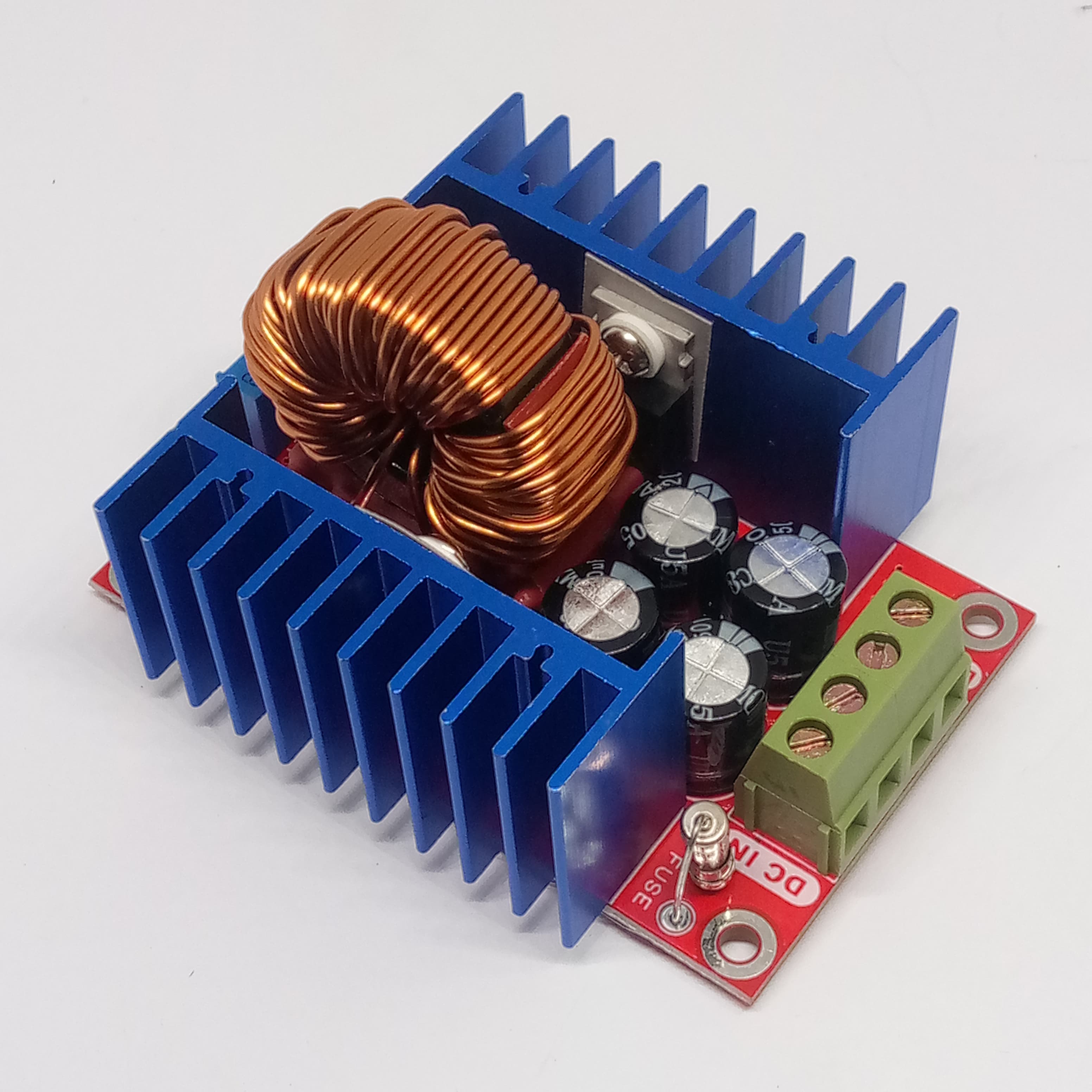 Adjustable 300W XL4016 DC To DC Step Down Buck Converter Module - with a large copper inductor, blue heat sinks, electrolytic capacitors, and a terminal block.