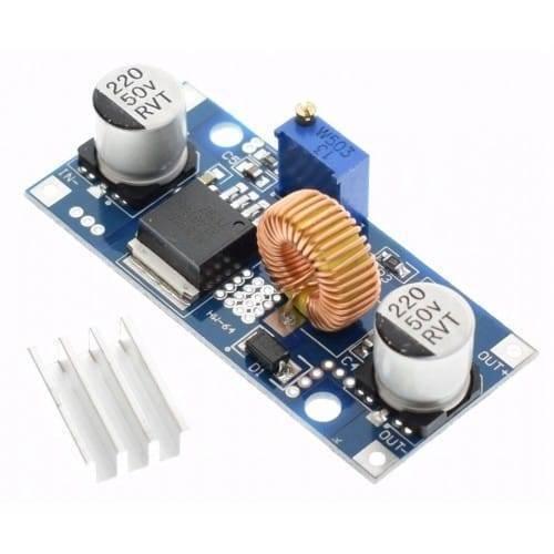 Adjustable DC To DC Step Down 5A Buck Converter With Heatsink XL4015 - the blue circuit board with two capacitors, an inductor, and a heatsink.