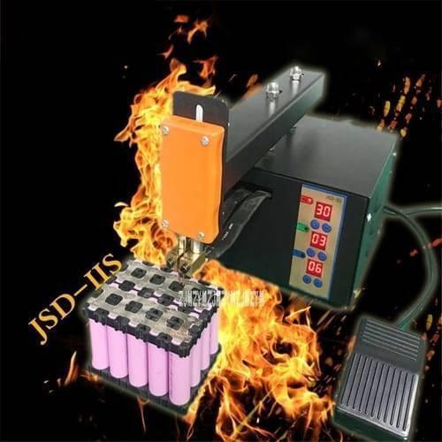 Adjustable Digital Display Point Welding Machine Jsd Iis Small Battery Pack Lithium Battery Welder - with an orange handle, a black main unit featuring three digital displays showing 30, 03, and 06, and a foot pedal.