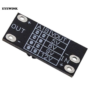 AL253 Boost Converter For Internet Router 5V 9V 12 DC Output Mini Converter Boost Step Ptcl D Link Tp Link - a small black rectangular circuit board with four soldering pads for input and output and a printed voltage selection table.