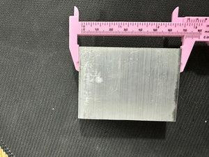 Aluminium Heat Sink For Ssr Relay LED COB And DIY Products - shown in a top-down view being measured by a pink plastic vernier caliper.