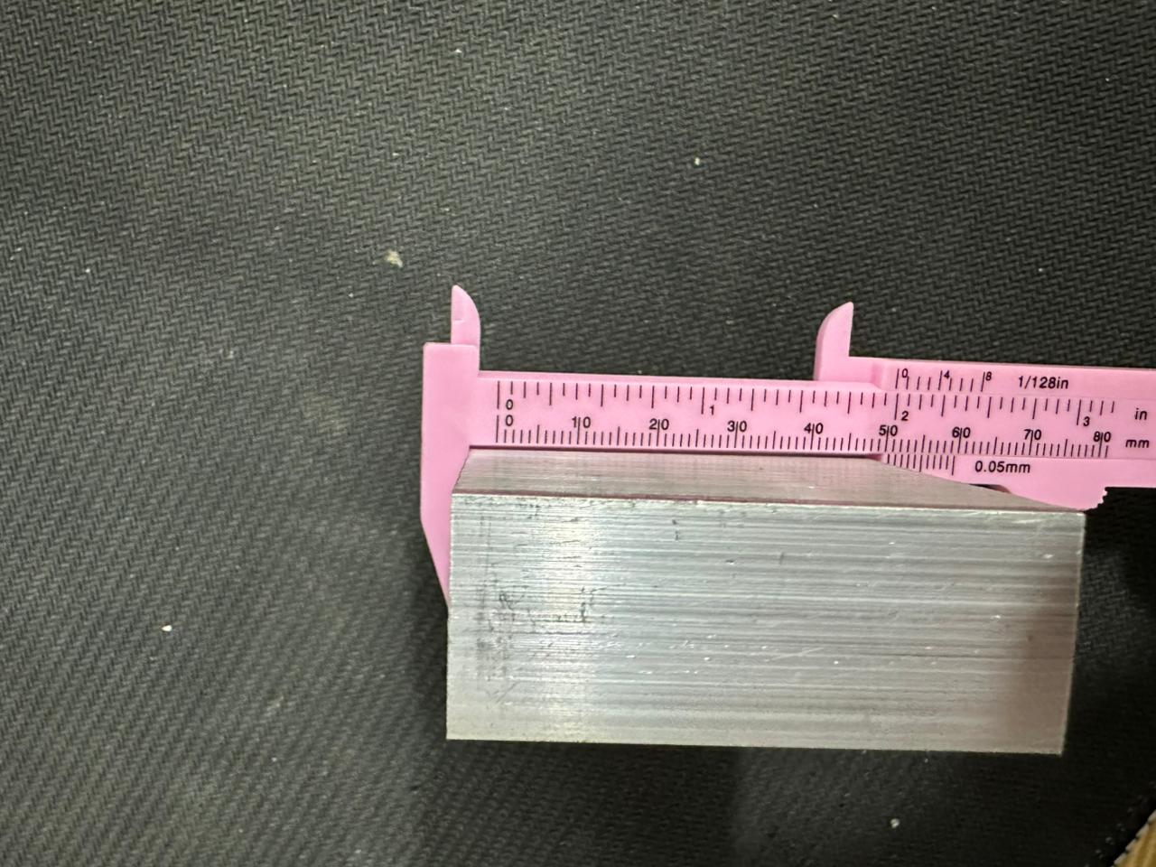 Aluminium Heat Sink For Ssr Relay LED COB And DIY Products - shown in a close-up dimension measurement using a pink plastic vernier caliper.