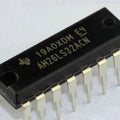 AM26LS32 26LS32 Quadruple Differential Line Receiver - a black 16-pin integrated circuit chip with metallic pins, shown in a close-up angled view.
