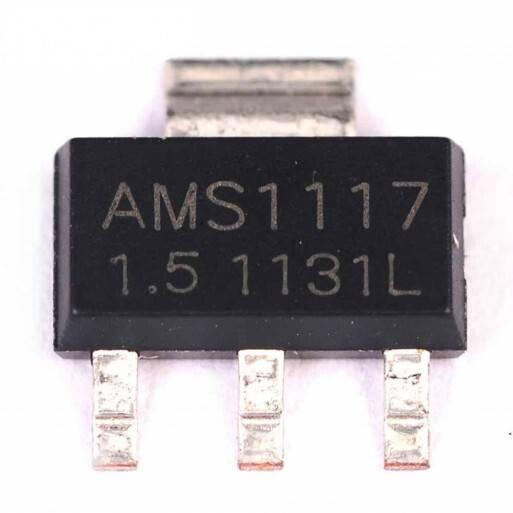 AMS1117 1.5V Voltage Regulator - a black SOT-223 electronic component with three metal pins and a top heat sink tab, showing printed text on its face.