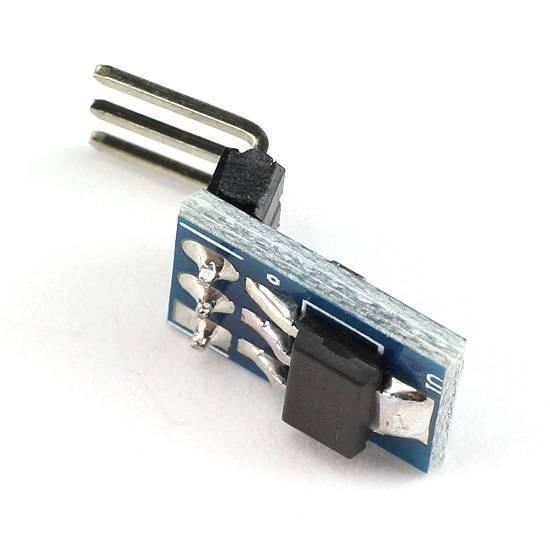 AMS1117-3.3 DC Voltage Regulator 3pin Step-down Power Supply Module - a blue rectangular circuit board with a black electronic component and three metal pins attached.