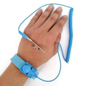 Anti-static ESD Wrist Strap With Grounding Wire – Electrostatic Discharge Protection Bracelet - shown as a blue fabric bracelet with a coiled cord and a metal alligator clip worn on a human wrist.