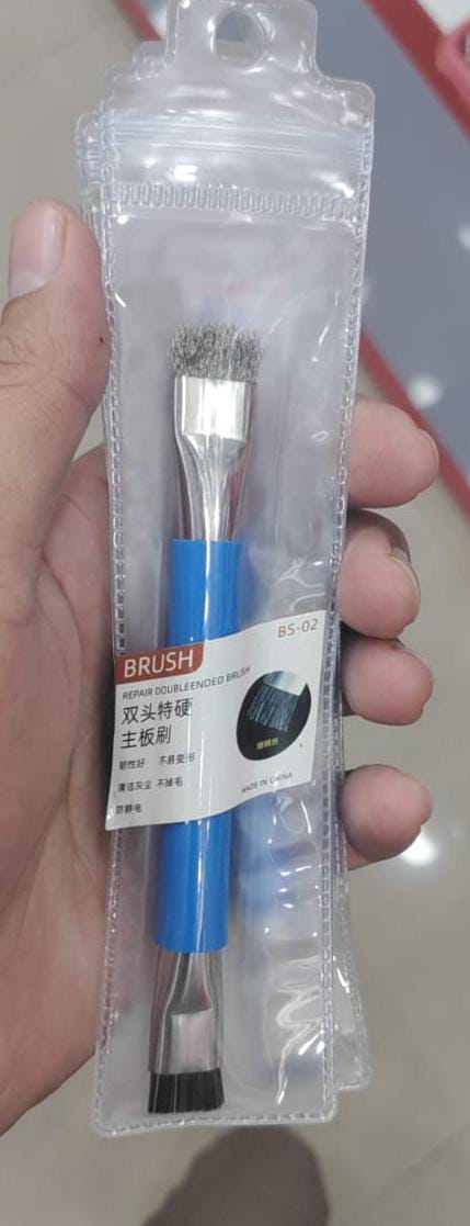 Antistatic Brush For PCB Cleaning - shown in its original plastic packaging with a blue handle and two distinct brush heads at either end.