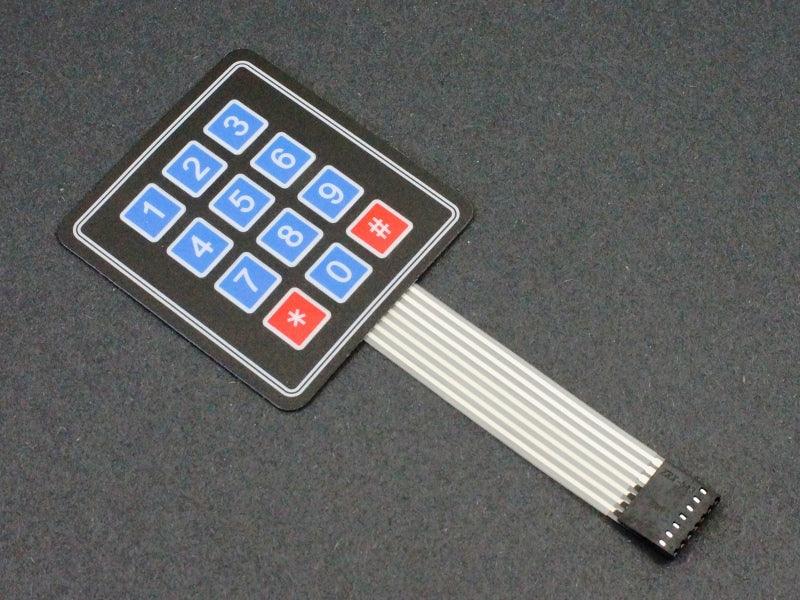 Arduino 3x4 Keypad 4×3 Matrix 12 Keys Membrane Switch Keypad - a black square panel with 12 numbered buttons and a flat 7-pin ribbon cable.