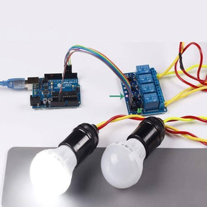 Arduino 4 Channel Relay Module Board - connected to an Arduino Uno and two light bulbs with jumper wires and yellow power cables.