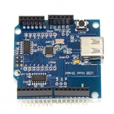 Arduino Compatible USB Host Shield - a blue circuit board featuring a USB Type-A port, a reset button, multiple pin headers, and integrated chips.