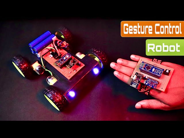 Arduino Gesture Control Robot Just Component - a four-wheeled robot chassis with blue LEDs and a handheld controller board featuring microcontrollers.
